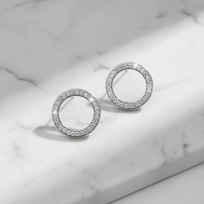 Silver Circle Stud Earrings on marble surface close-up | OriaJewel