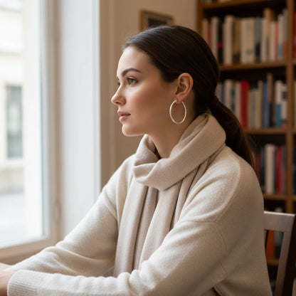 Silver Classic Hoop Earrings worn with beige scarf by window | OriaJewel