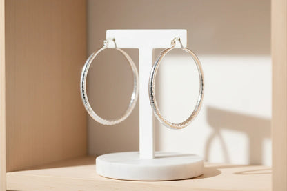 Silver Classic Hoop Earrings on white display stand | OriaJewel