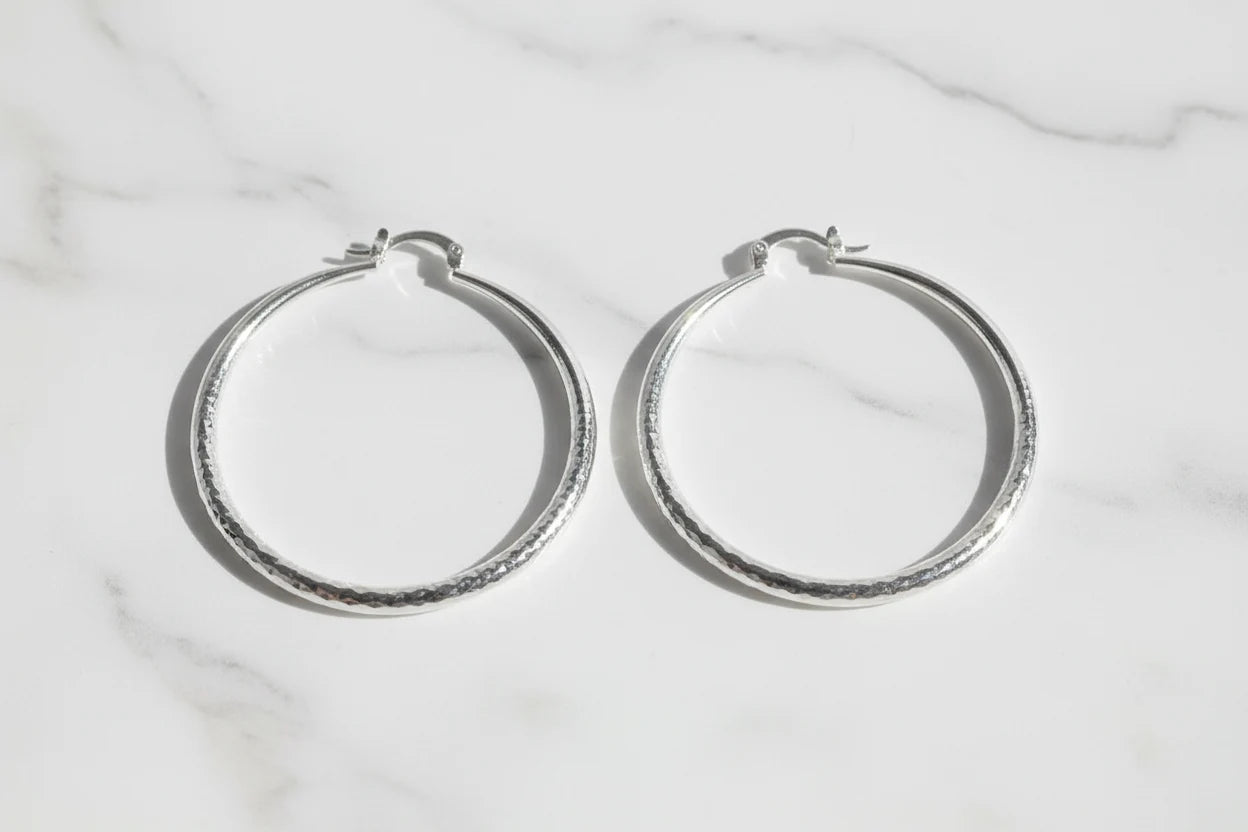 Silver Classic Hoop Earrings pair on marble background | OriaJewel