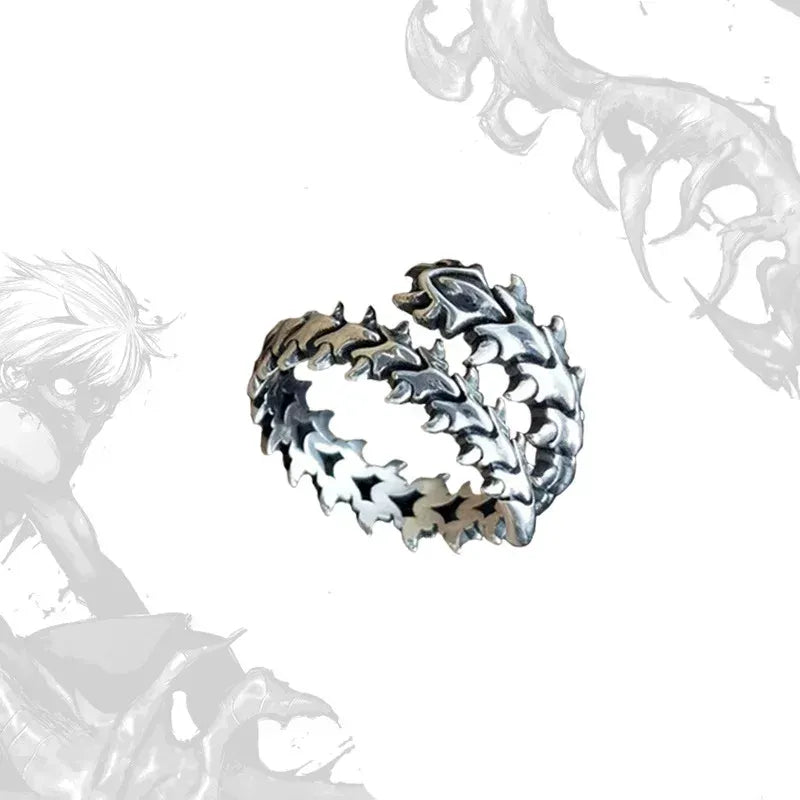 Silver Fishbone Ring product cutout on a clean white background, highlighting the detailed fishbone spine pattern, jagged link texture, and open wrap structure with a darkened antique silver tone | OriaJewel