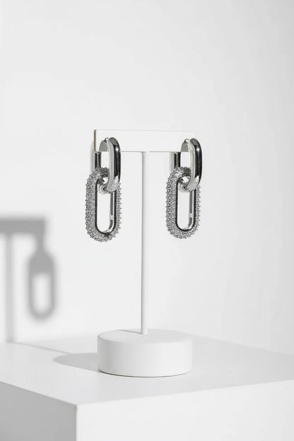 Silver Link Drop Earrings hanging on white stand, pavé paperclip link drops | OriaJewel