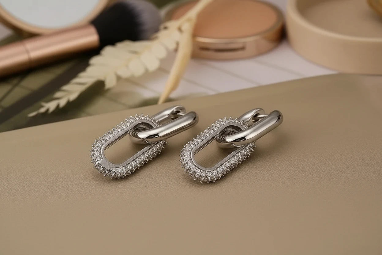 Silver Link Drop Earrings flat lay near makeup tools, pavé paperclip link drops | OriaJewel