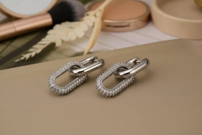 Silver Link Drop Earrings flat lay near makeup tools, pavé paperclip link drops | OriaJewel