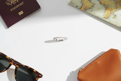 Silver Midi Ring Set styled in a travel flat-lay with passport, map, sunglasses, and leather pouch on a bright surface | OriaJewel