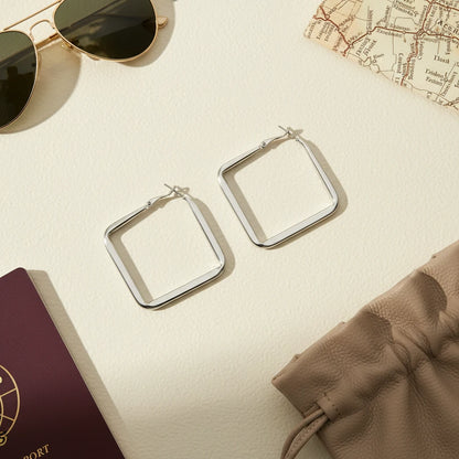 Silver Square Hoop Earrings flat lay with passport and sunglasses | OriaJewel