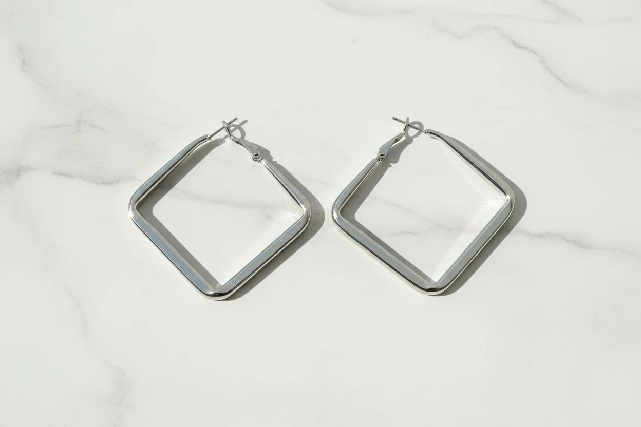 Silver Square Hoop Earrings on marble surface in soft daylight | OriaJewel