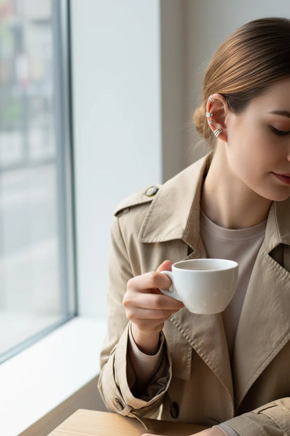 Silver 5-Piece Ear Cuff Set worn on model with coffee by window | OriaJewel