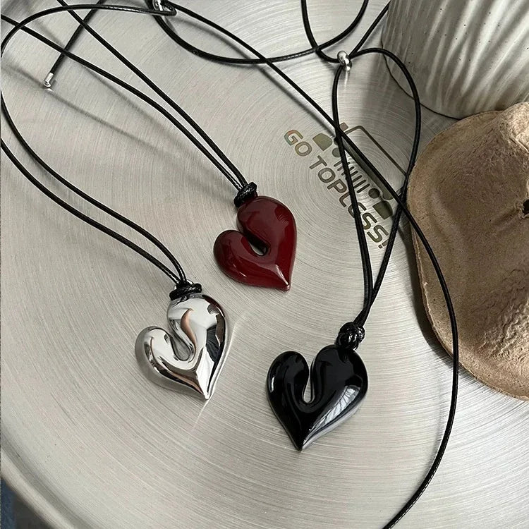 Simple Heart Pendant Necklace in silver, red, and black displayed on a neutral background | Oria Jewel