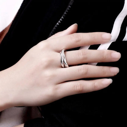 Sterling Silver Crossover Ring worn on a hand, showcasing its elegant design and fine craftsmanship | Oria Jewel
