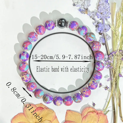 Size chart showing the Stretch-fit Stress Relief Gemstone Bracelet with purple beads and floral decoration around it | Oria Jewel