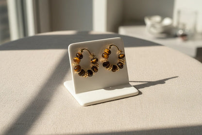 Tiger Eye Beaded Hoop Earrings on display stand in soft window light | OriaJewel