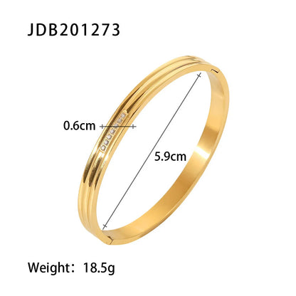 Product dimensions image showing the Triple Line Gold Hinged Bangle with 5.9 cm inner diameter, 0.6 cm band width, and 18.5 g weight against a white background | Oria Jewel