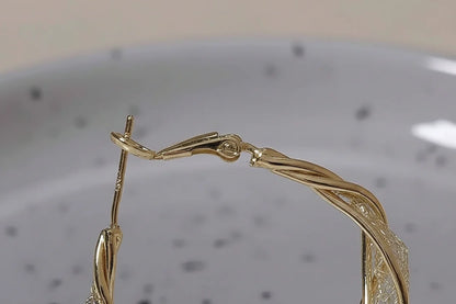 Twisted Crossover Hoop Earrings clasp detail close-up | OriaJewel
