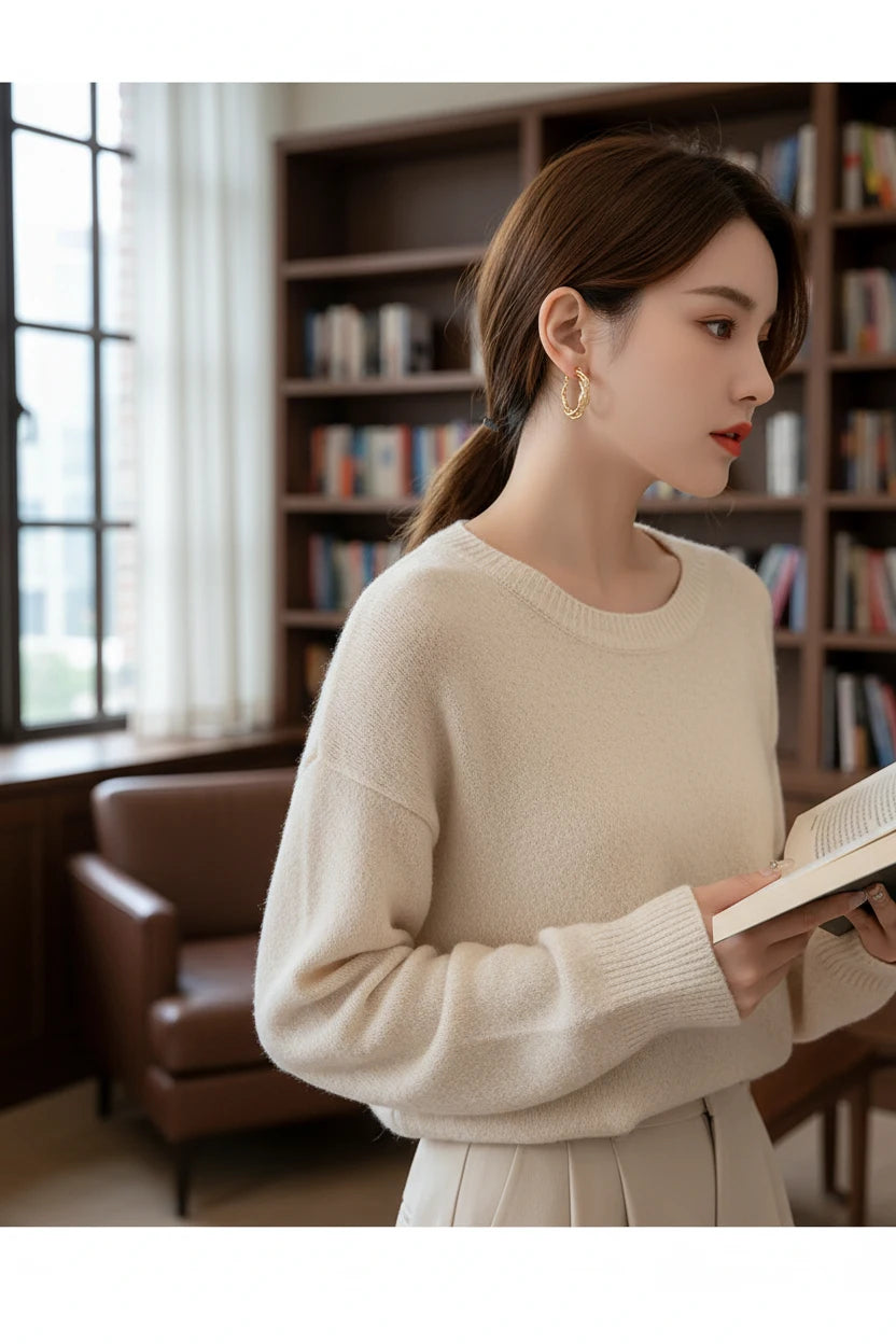 Twisted Crossover Hoop Earrings worn on model in library setting | OriaJewel