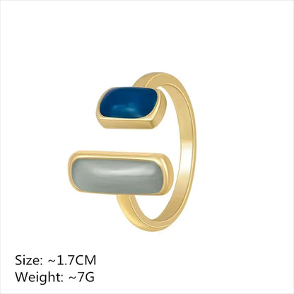 Two Stone Open Ring product close-up on a clean white background, showing the open adjustable design with two rectangular stones (ivory and deep blue) | OriaJewel