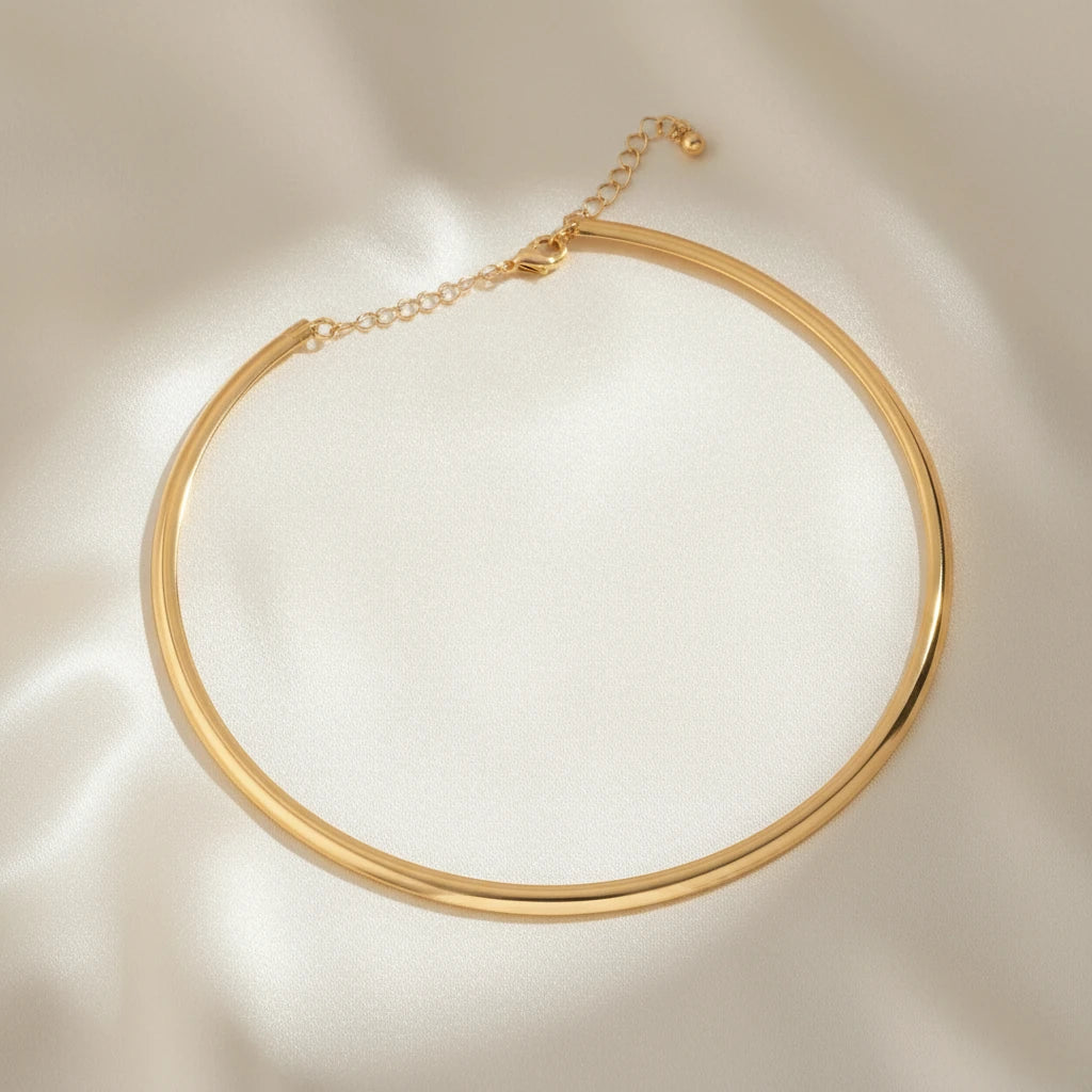 Vintage Choker Necklace in gold displayed on smooth satin fabric under soft light for elegant presentation | Oria Jewel