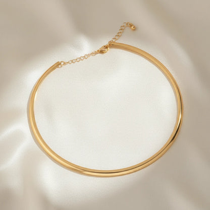 Vintage Choker Necklace in gold displayed on smooth satin fabric under soft light for elegant presentation | Oria Jewel