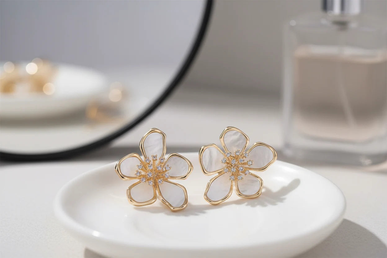 White Flower CZ Stud Earrings on a dish with mirror and perfume | OriaJewel