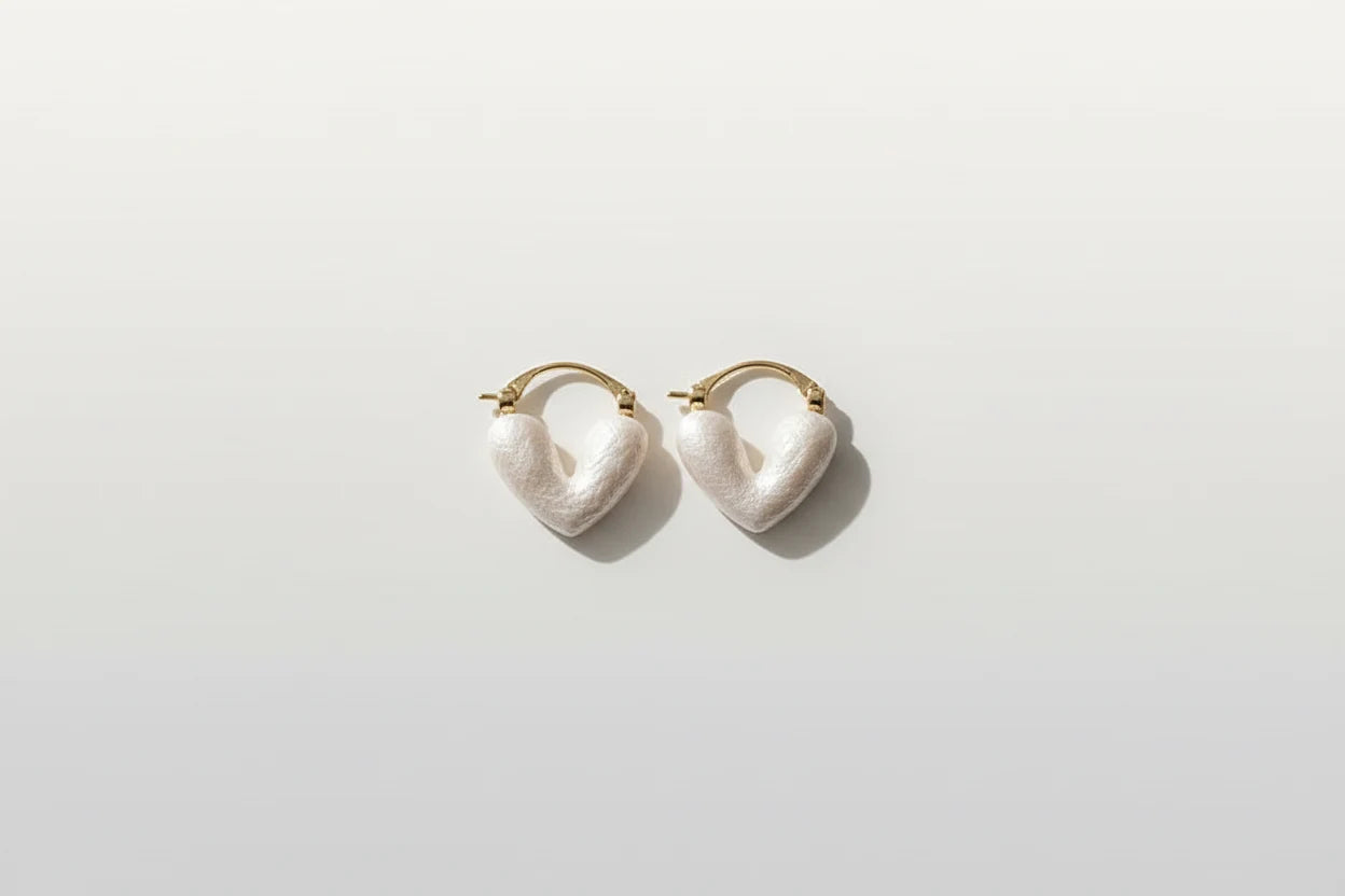White Heart Huggie Hoop Earrings isolated on white background | OriaJewel