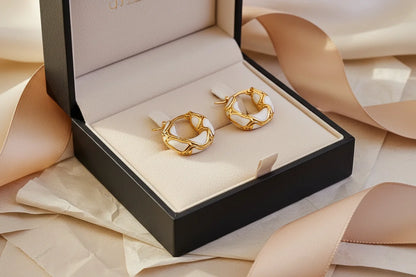 White Huggie Hoop Earrings in gift box with ribbon and soft beige styling | OriaJewel