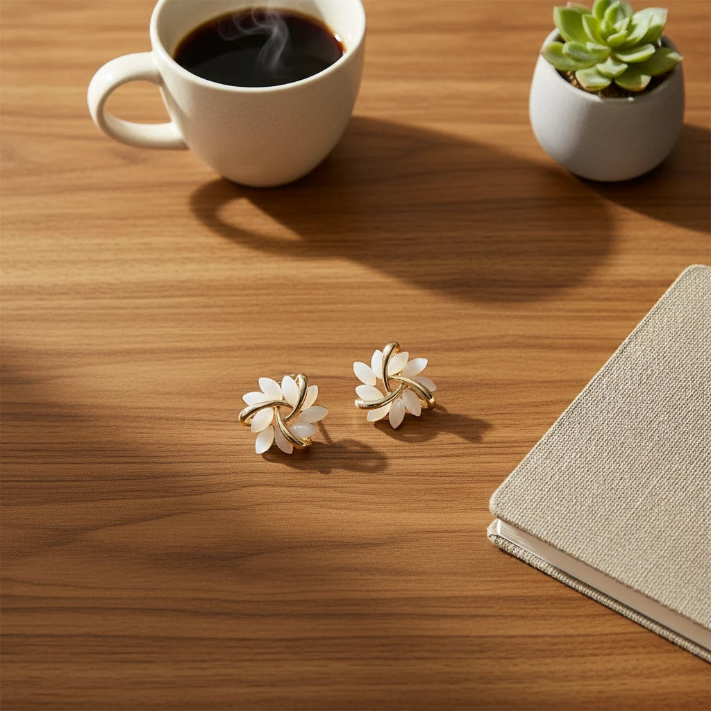 White Petal Cluster Stud Earrings flat lay on wooden desk with coffee | OriaJewel