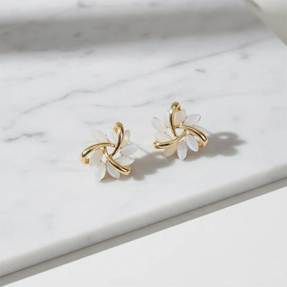White Petal Cluster Stud Earrings close-up on marble surface | OriaJewel