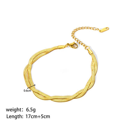 Studio product shot of a lightweight double chain gold bracelet with extender chain, lobster clasp, and size measurements on a clean white background | Oria Jewel