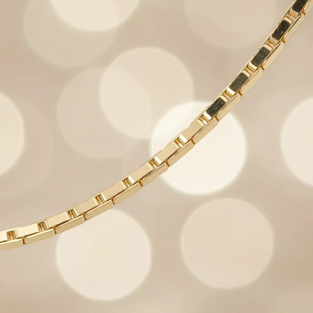 Macro close-up of Flat Chain Choker links showing polished gold surface and smooth edges | Oria Jewel