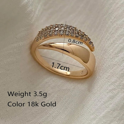 Close-up infographic-style image of a gold bypass ring with size markings (1.7cm, 0.8cm) and product text details shown on the photo | OriaJewel