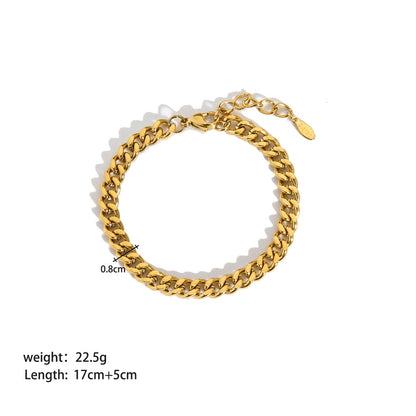 Product shot of gold curb chain bracelet on white background showing size, length, and weight measurements for shoppers | Oria Jewel