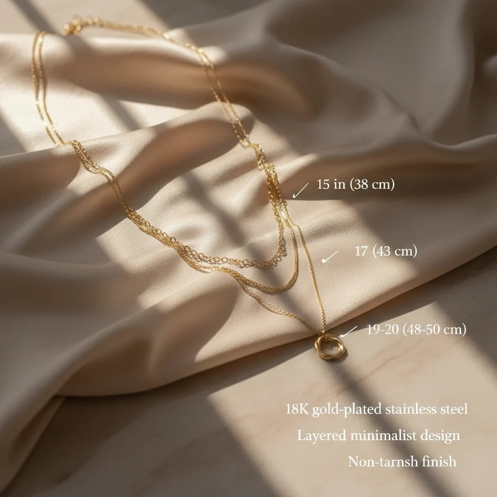 Multi Layered Gold Chain Necklace displayed on satin with text showing chain lengths and 18K gold-plated design | Oria Jewel