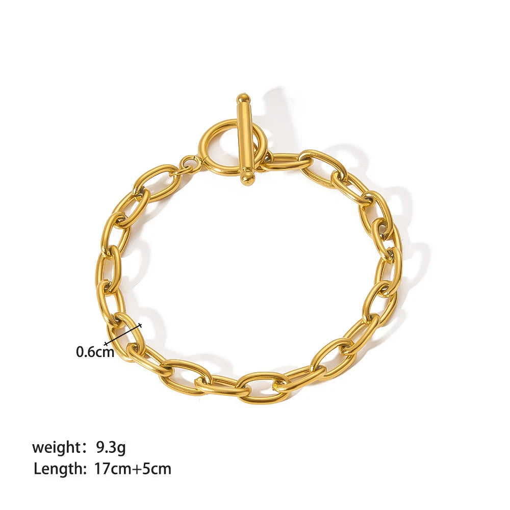 Studio image of adjustable oval link chain bracelet on white background showing toggle clasp, width, weight and length measurements for shoppers | Oria Jewel