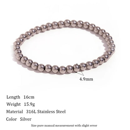 Close product image of a 4.9mm Silver Beaded Stretch Bracelet on a white background with measurements and stainless steel material details, highlighting its smooth, reflective round beads | Oria Jewel