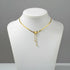 White display bust presenting refined gold variant of Silver Butterfly Chain Necklace against simple grey background | Oria Jewel